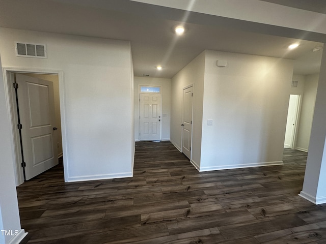 empty room featuring dark wood-type flooring