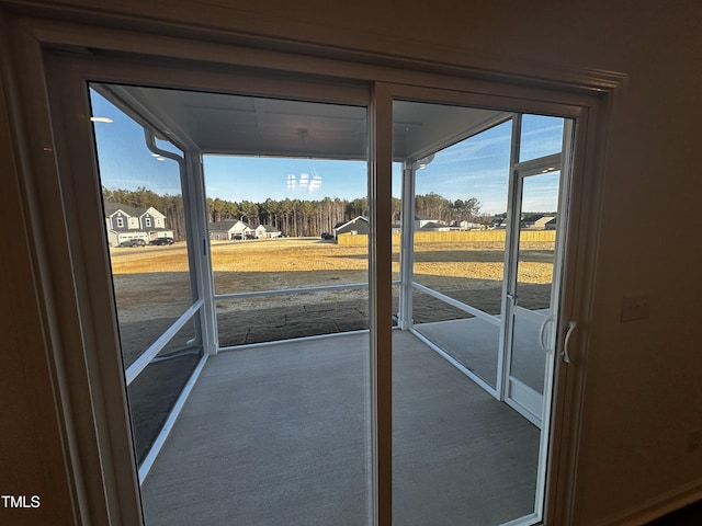 doorway to outside featuring a healthy amount of sunlight