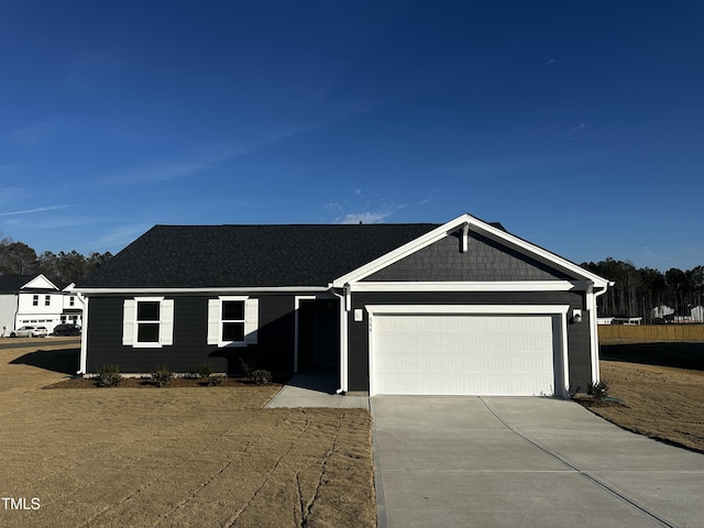 ranch-style home featuring a garage