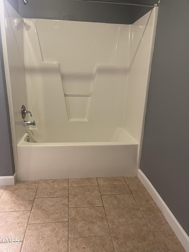 bathroom featuring bathtub / shower combination and tile patterned floors