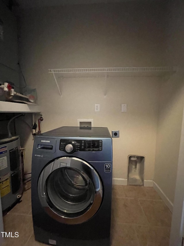 laundry area with washer / clothes dryer, electric water heater, and light tile patterned floors