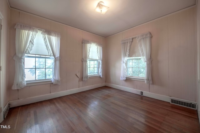 spare room with hardwood / wood-style flooring