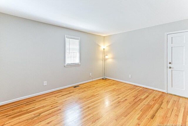 empty room with light wood-type flooring