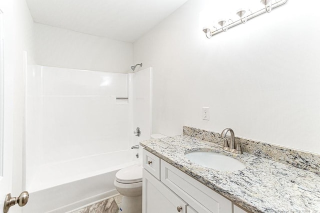 full bathroom featuring bathtub / shower combination, vanity, and toilet