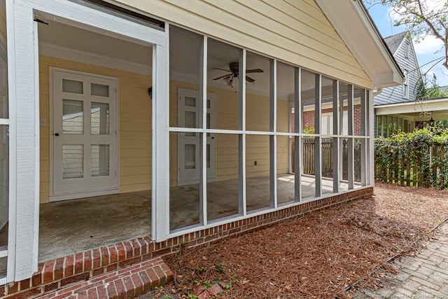 view of side of home with a sunroom