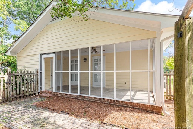 back of house with a sunroom