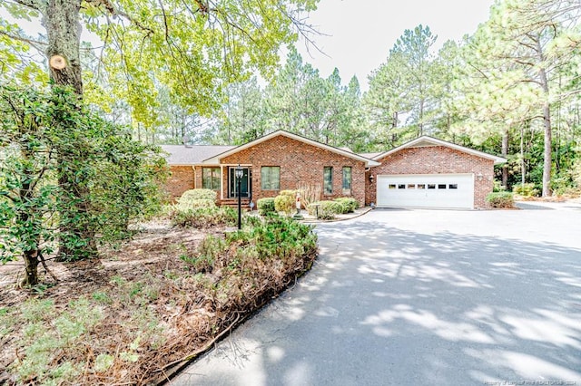 ranch-style home featuring a garage