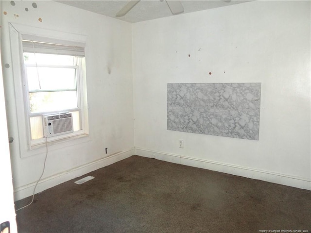 carpeted empty room with ceiling fan and cooling unit