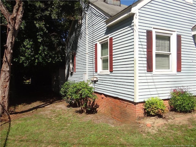 view of home's exterior featuring a lawn