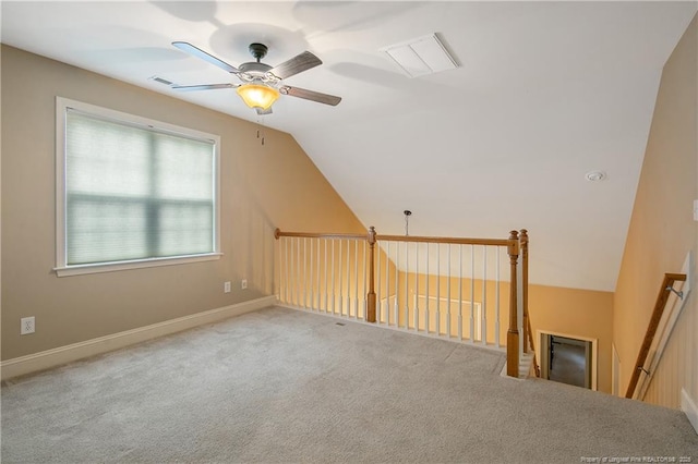 bonus room with ceiling fan, carpet floors, and vaulted ceiling