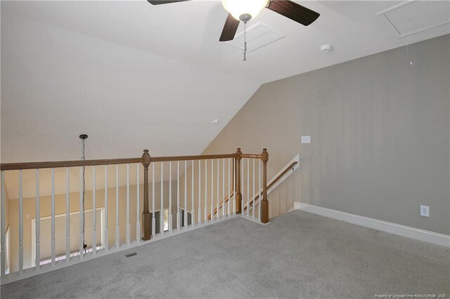 bonus room with lofted ceiling and carpet