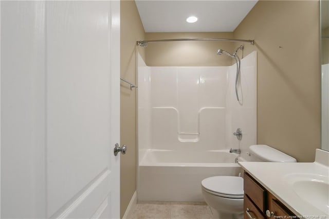 full bathroom featuring vanity, toilet,  shower combination, and tile patterned flooring