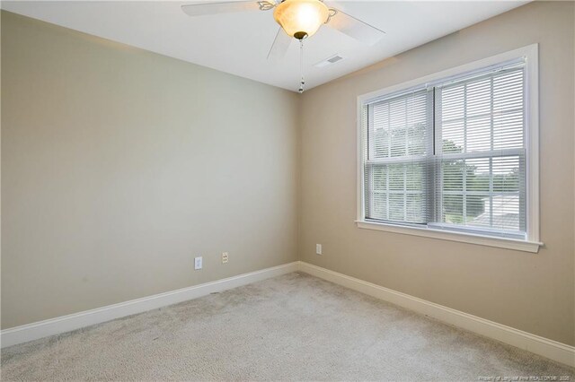 carpeted empty room with ceiling fan