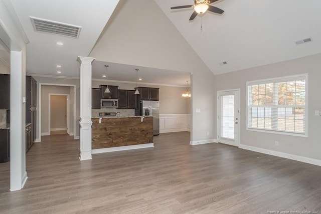 5737 Pooh Ave, Stedman, NC 28391 - unfurnished living room featuring decorative columns, a ceiling fan, wood finished floors, high vaulted ceiling, and recessed lighting