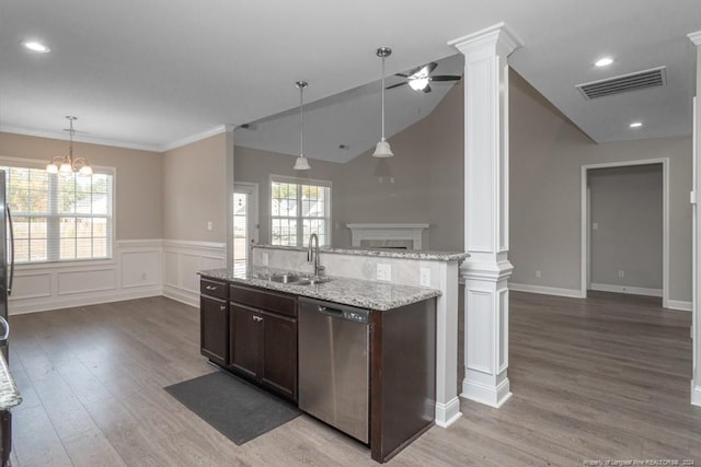 5737 Pooh Ave, Stedman, NC 28391 - kitchen featuring dishwasher, ornate columns, a sink, wood finished floors, and dark brown cabinets