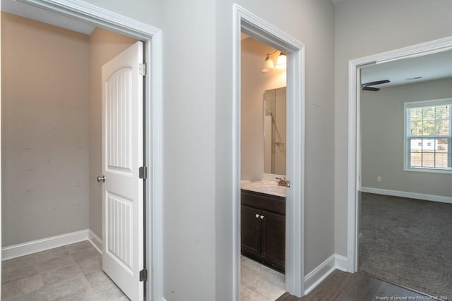 5737 Pooh Ave, Stedman, NC 28391 - hall with a sink and baseboards