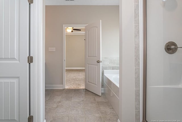 bathroom with tile patterned flooring, ceiling fan, and independent shower and bath