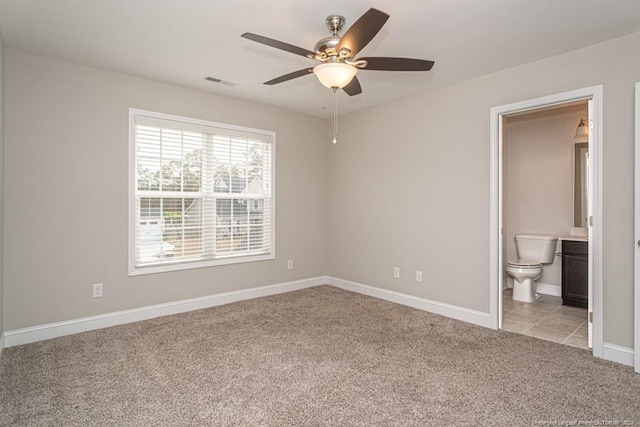 5737 Pooh Ave, Stedman, NC 28391 - unfurnished bedroom with light carpet, baseboards, ensuite bath, and ceiling fan