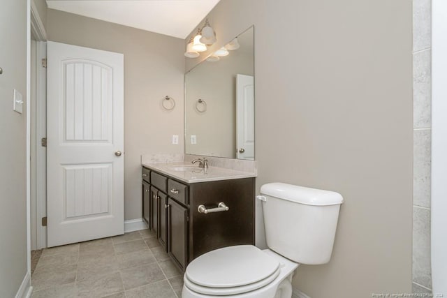 5737 Pooh Ave, Stedman, NC 28391 - bathroom with vanity, toilet, baseboards, and tile patterned floors
