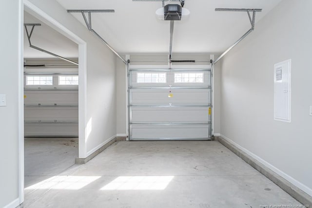 5737 Pooh Ave, Stedman, NC 28391 - garage with a garage door opener, baseboards, and electric panel