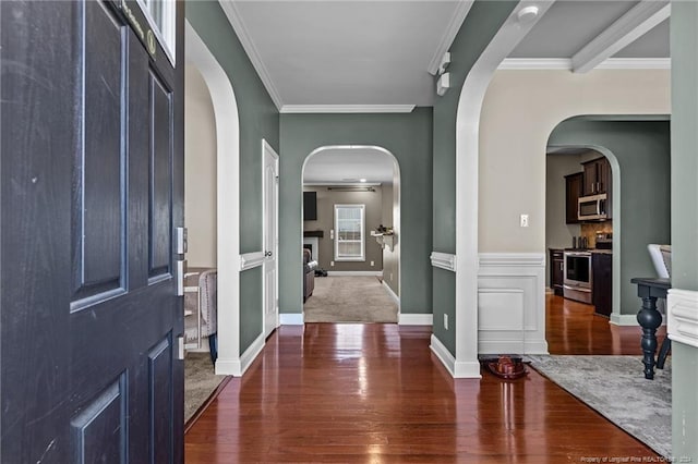 entrance foyer featuring crown molding and dark hardwood / wood-style floors