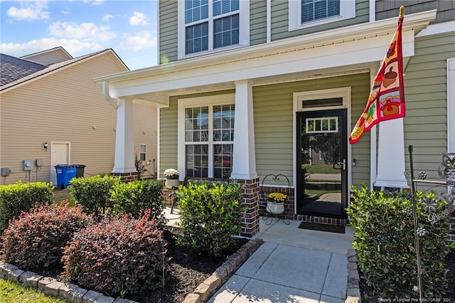 doorway to property with a porch