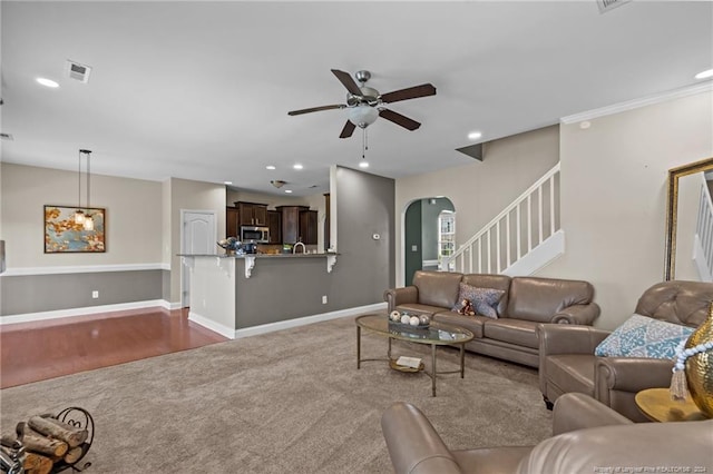 living room with hardwood / wood-style flooring and ceiling fan