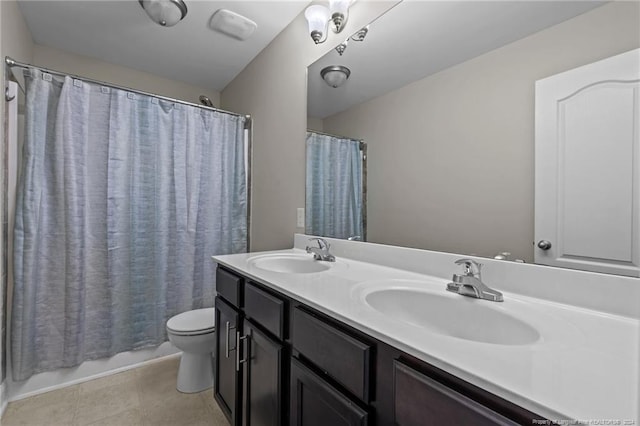 full bathroom with vanity, shower / bath combo with shower curtain, toilet, and tile patterned floors