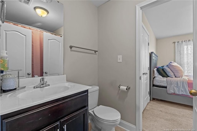 bathroom featuring vanity and toilet