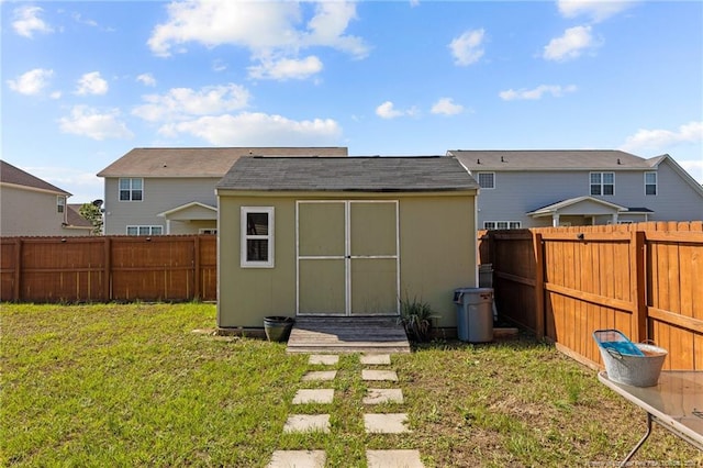 exterior space with a shed and a lawn