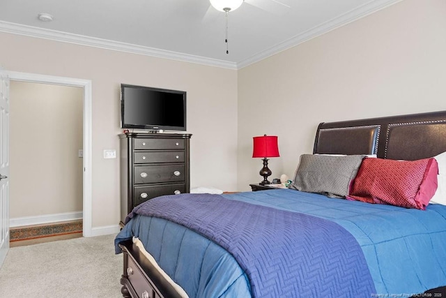 carpeted bedroom featuring ceiling fan and ornamental molding