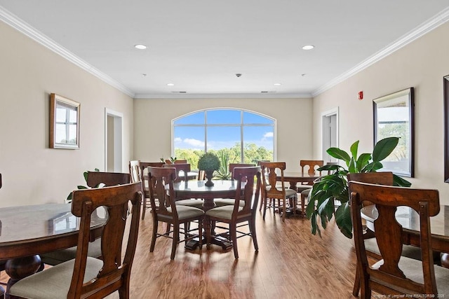 dining room with crown molding and a wealth of natural light