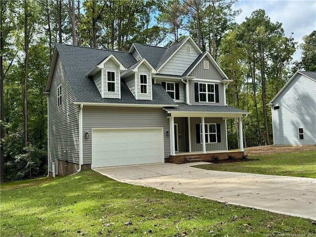 view of front of home featuring a front yard and a garage