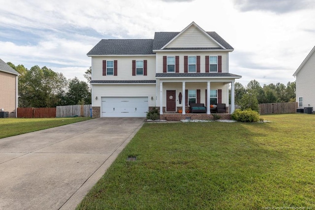 view of front of home featuring a garage, a front yard, central AC, and covered porch