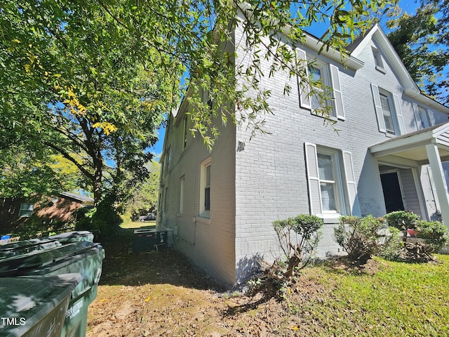 view of side of property with central AC unit