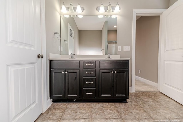 bathroom with vanity and tile patterned flooring