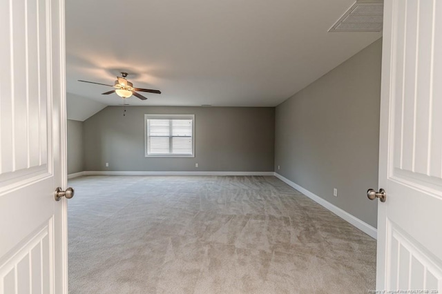 bonus room with lofted ceiling, light colored carpet, and ceiling fan