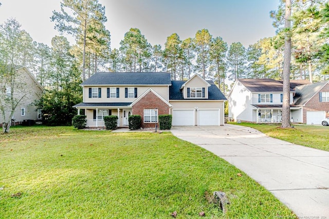 3375 Carolina Way, Sanford, NC 27332 - view of front of property featuring a garage, a porch, concrete driveway, and a front lawn
