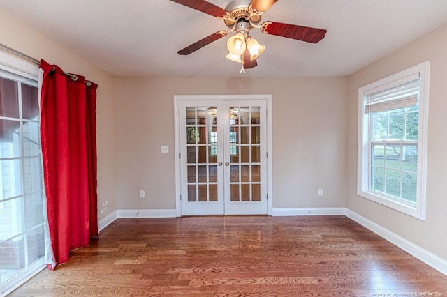 3375 Carolina Way, Sanford, NC 27332 - empty room featuring french doors, wood finished floors, a ceiling fan, and baseboards