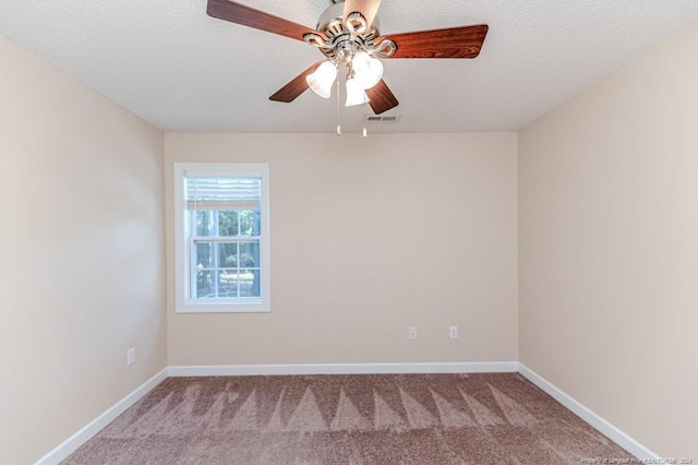 empty room featuring a textured ceiling, ceiling fan, and light colored carpet