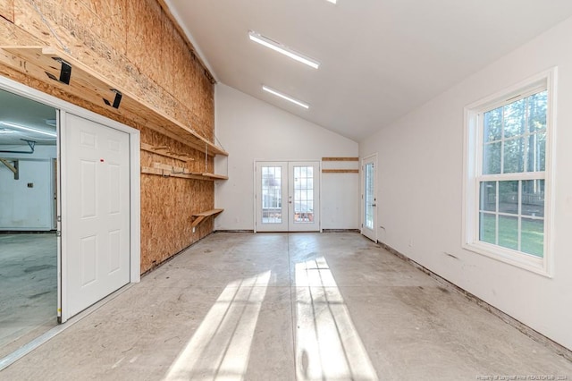 3375 Carolina Way, Sanford, NC 27332 - unfurnished living room with concrete flooring, french doors, lofted ceiling, and plenty of natural light