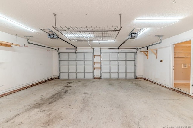 3375 Carolina Way, Sanford, NC 27332 - garage with a garage door opener and baseboards