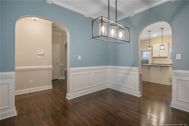 unfurnished dining area featuring ornamental molding and dark hardwood / wood-style floors