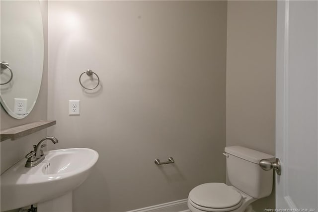 bathroom with sink and toilet