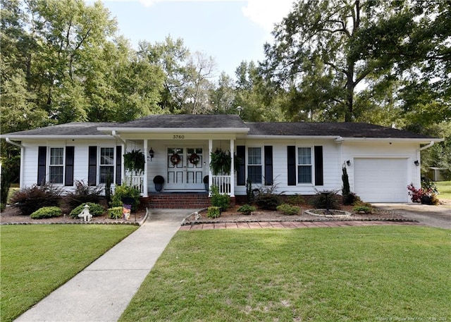 single story home featuring a garage, a porch, and a front yard