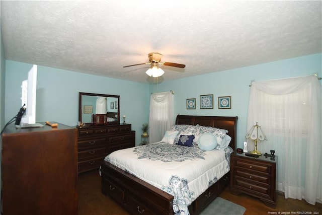 bedroom featuring a textured ceiling and ceiling fan