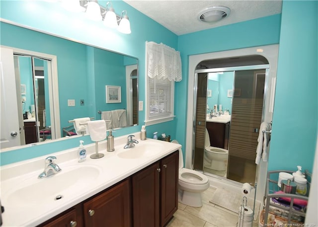 3760 Berkley Ln, Lumberton, NC 28358 - full bath featuring double vanity, a stall shower, and tile patterned floors