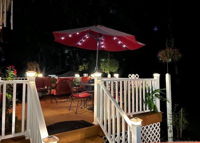 3760 Berkley Ln, Lumberton, NC 28358 - deck at twilight featuring outdoor dining area