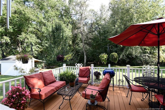 3760 Berkley Ln, Lumberton, NC 28358 - wooden deck featuring an outdoor living space, outdoor dining area, an outdoor structure, and a lawn