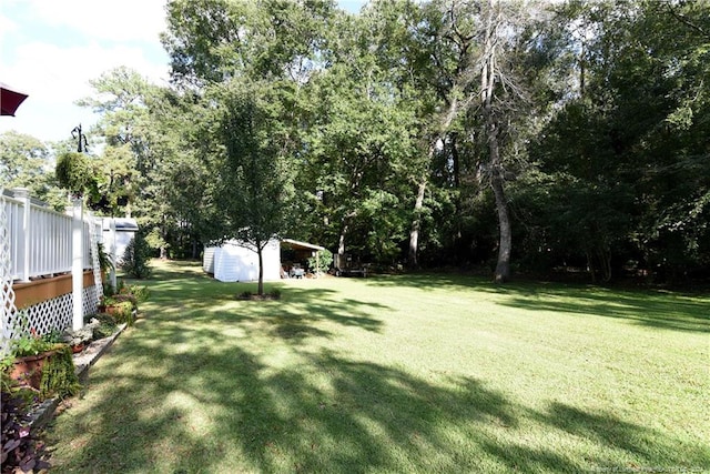 3760 Berkley Ln, Lumberton, NC 28358 - view of green lawn featuring a storage unit